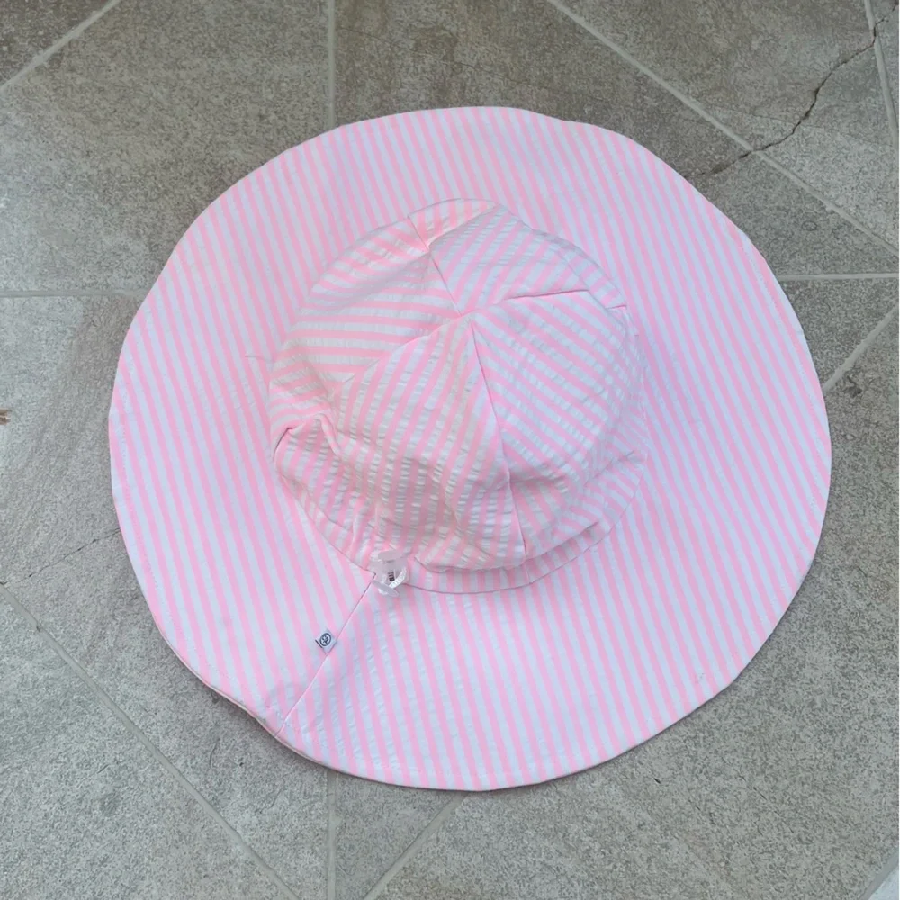 Caden Lane neon pink and white seersucker stripe sun hat